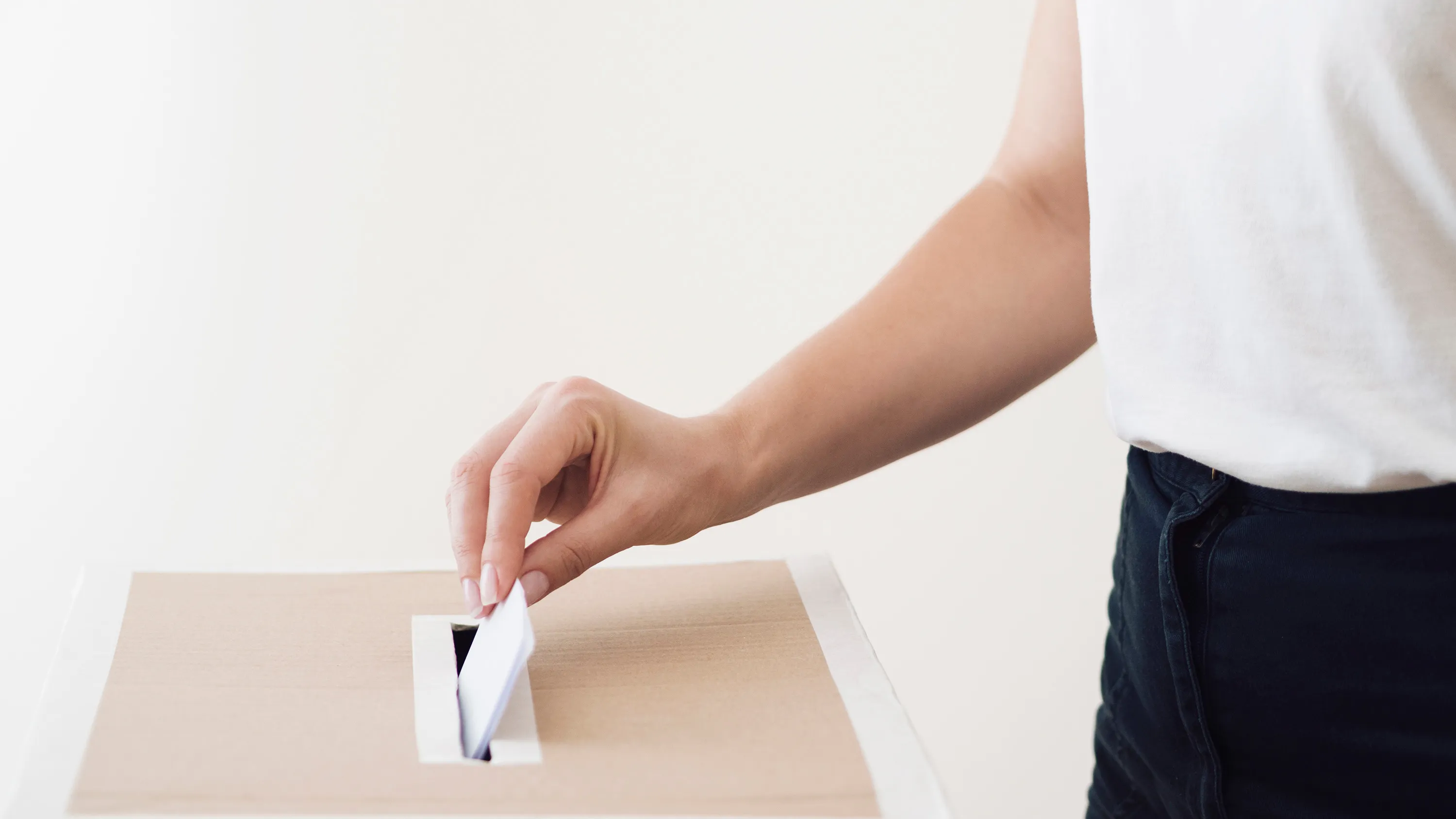 side-view-person-placing-ballot-election-box